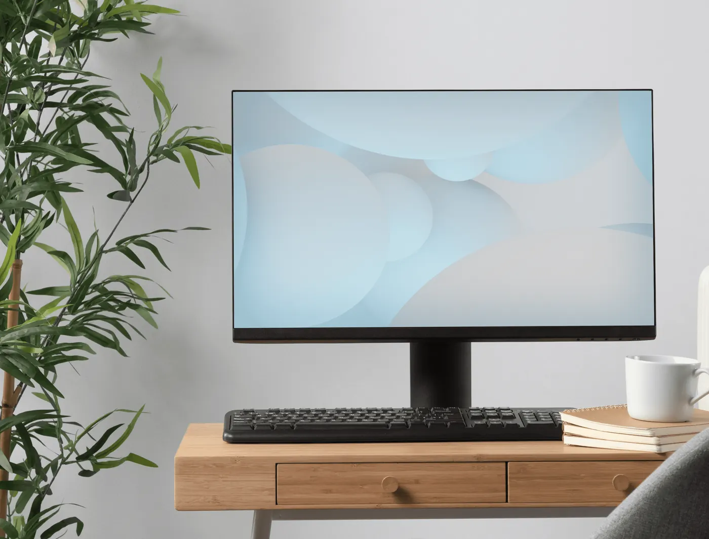 A refurbished monitor and keyboard on a wooden desk